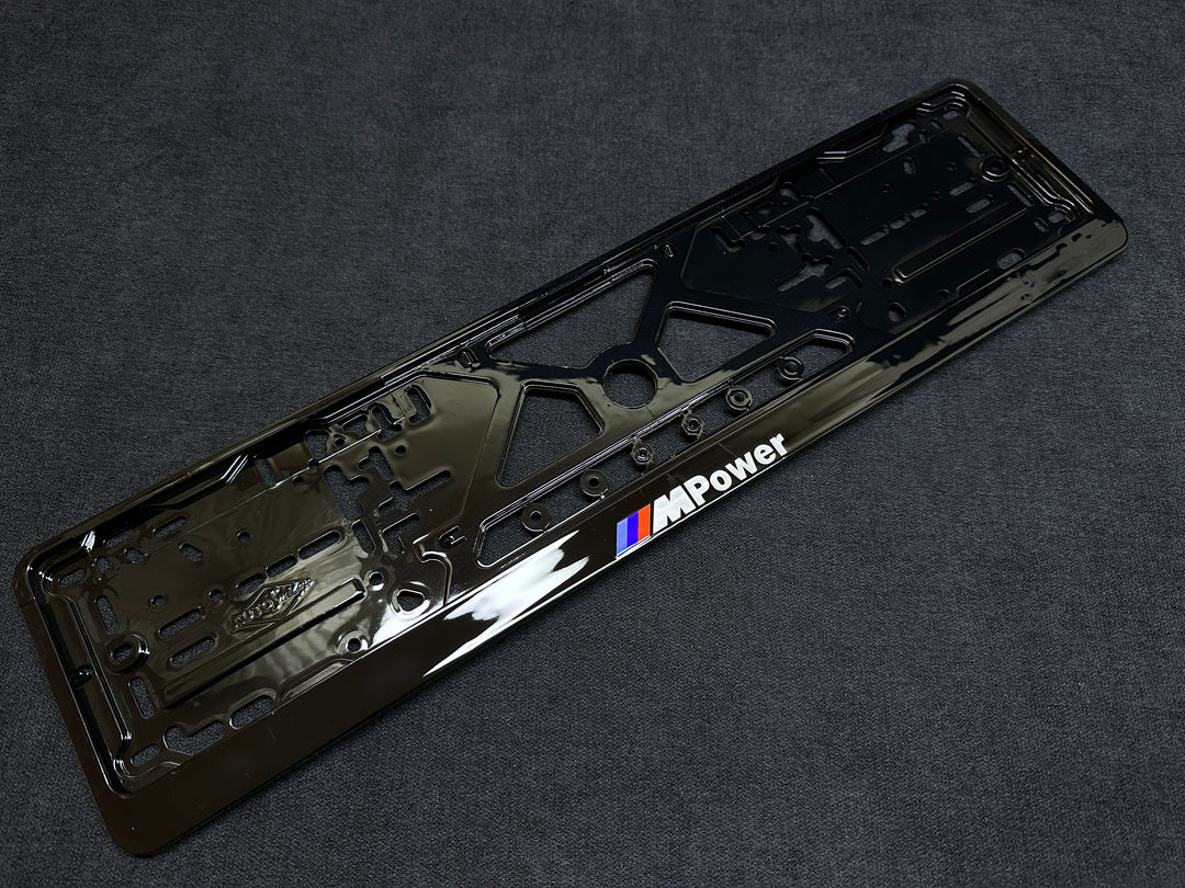 A black license plate frame with 'M Power' branding for BMW vehicles.