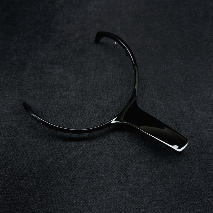 A black steering wheel middle trim with a glossy finish, designed for a BMW F-Series 