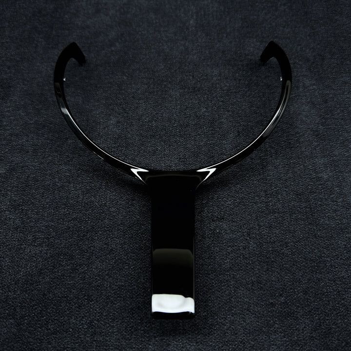 A black steering wheel middle trim with a glossy finish, designed for a BMW F-Series vehicle