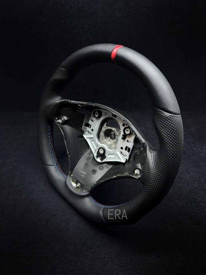 BMW E90 perforated leather steering wheel with a red stripe and M stitching 