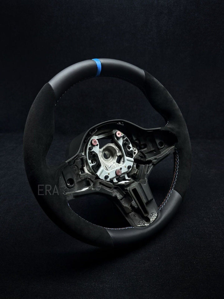 BMW leather steering wheel with a light blue stripe and black stitching