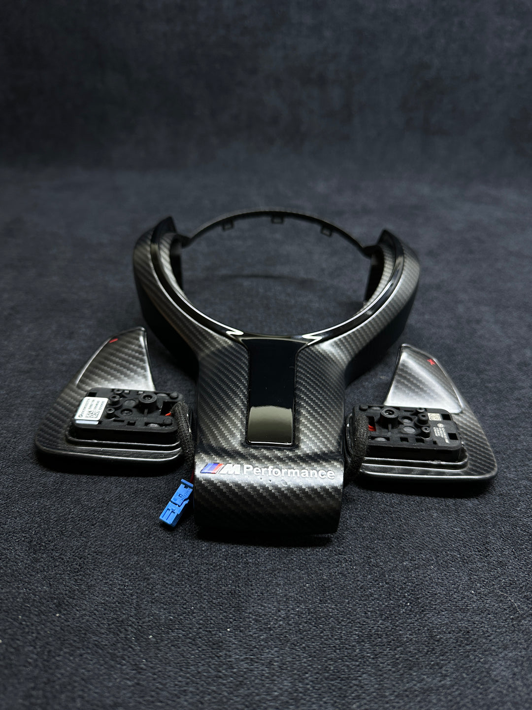 Carbon fiber style car steering wheel trim with BMW Performance shift paddles