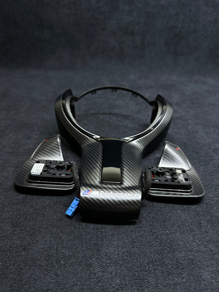 Carbon fiber style car steering wheel trim with BMW Performance shift paddles