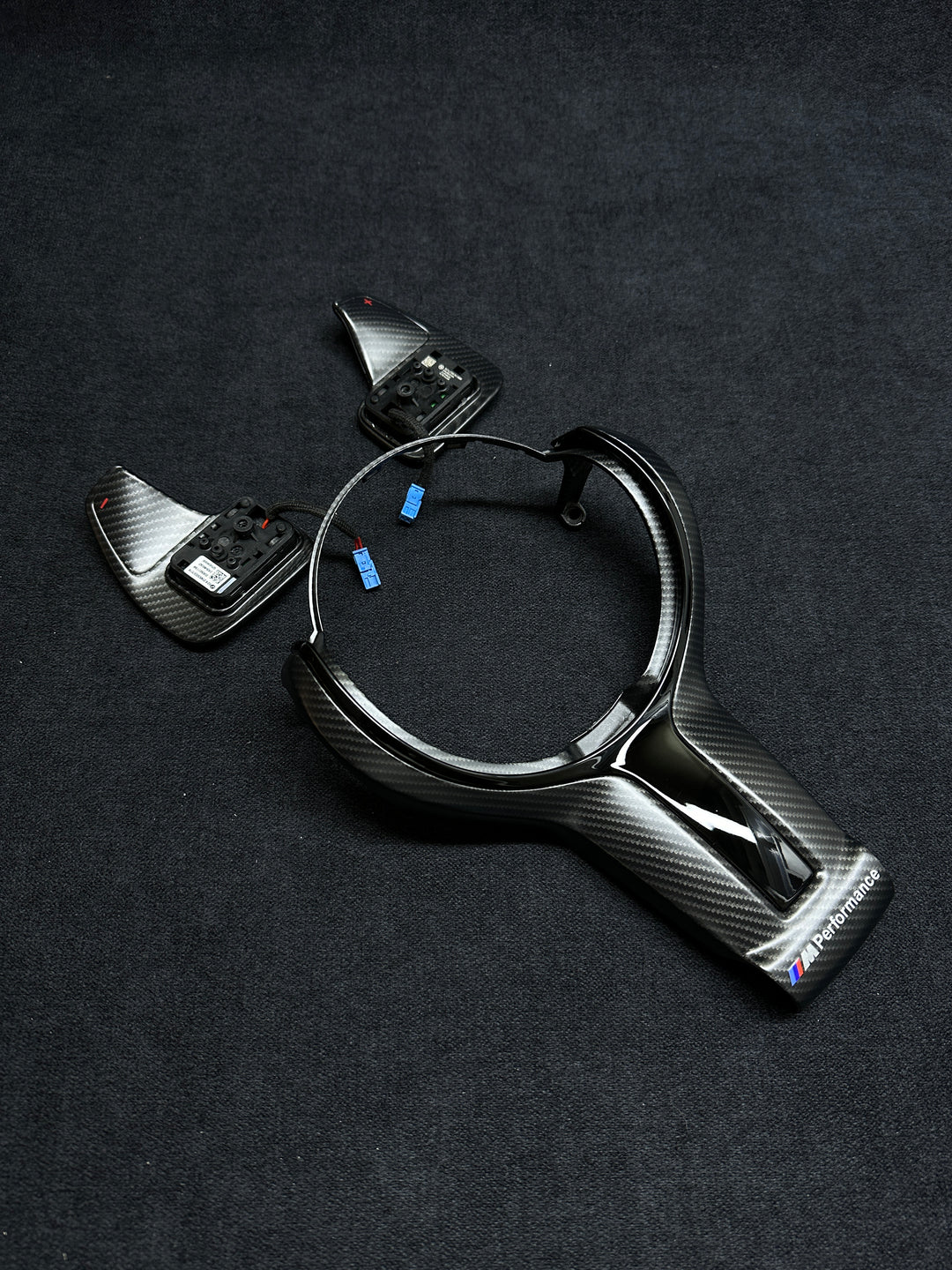 Carbon fiber style car steering wheel trim with BMW Performance shift paddles piano black
