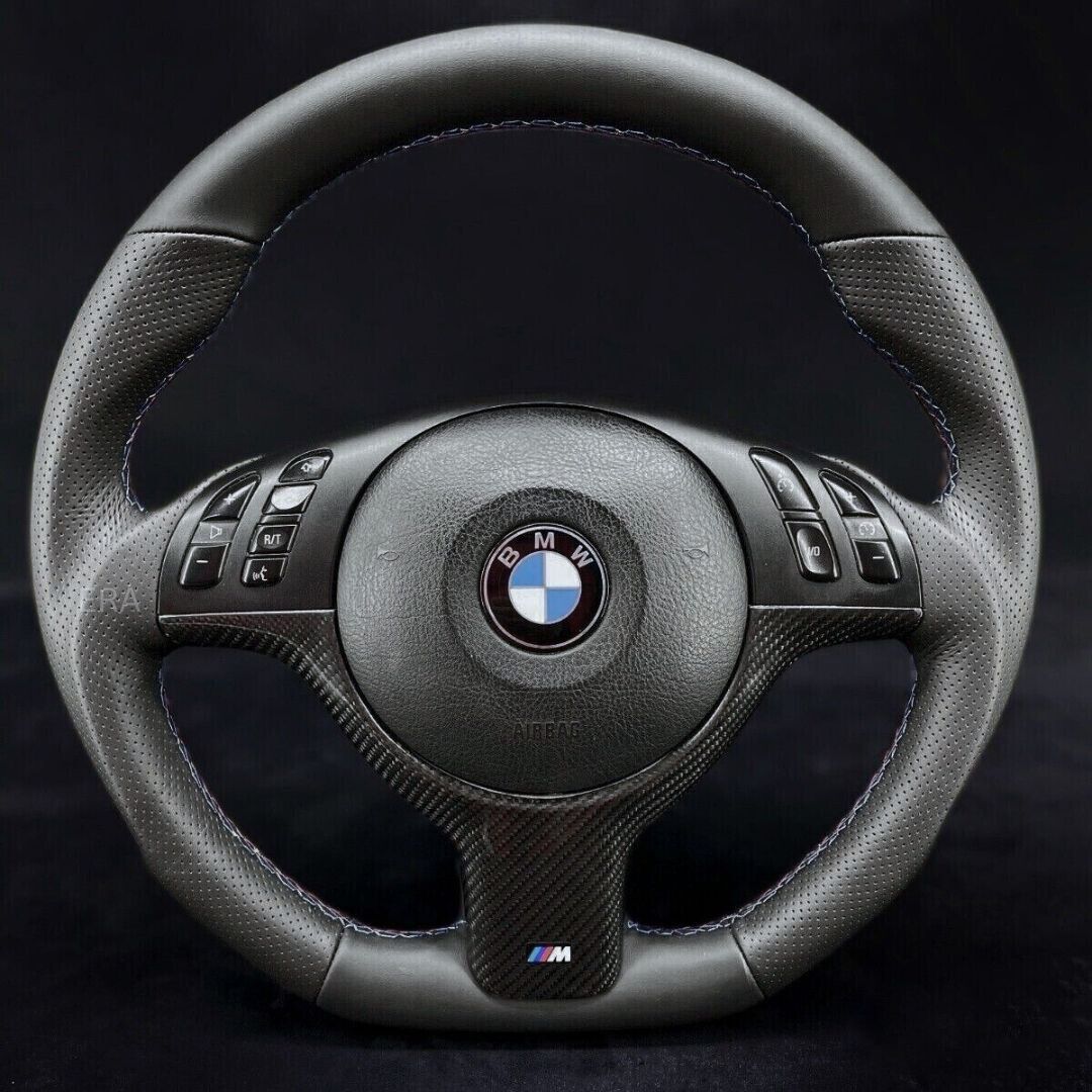 Custom steering wheel for BMW with Nappa-perforated leather, carbon trim, and M stitching.