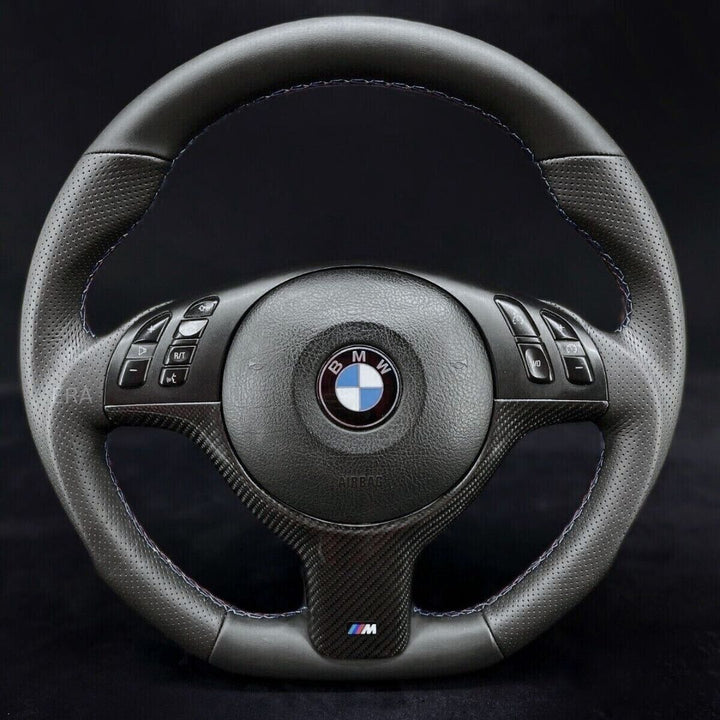 Custom steering wheel for BMW with Nappa-perforated leather, carbon trim, and M stitching.