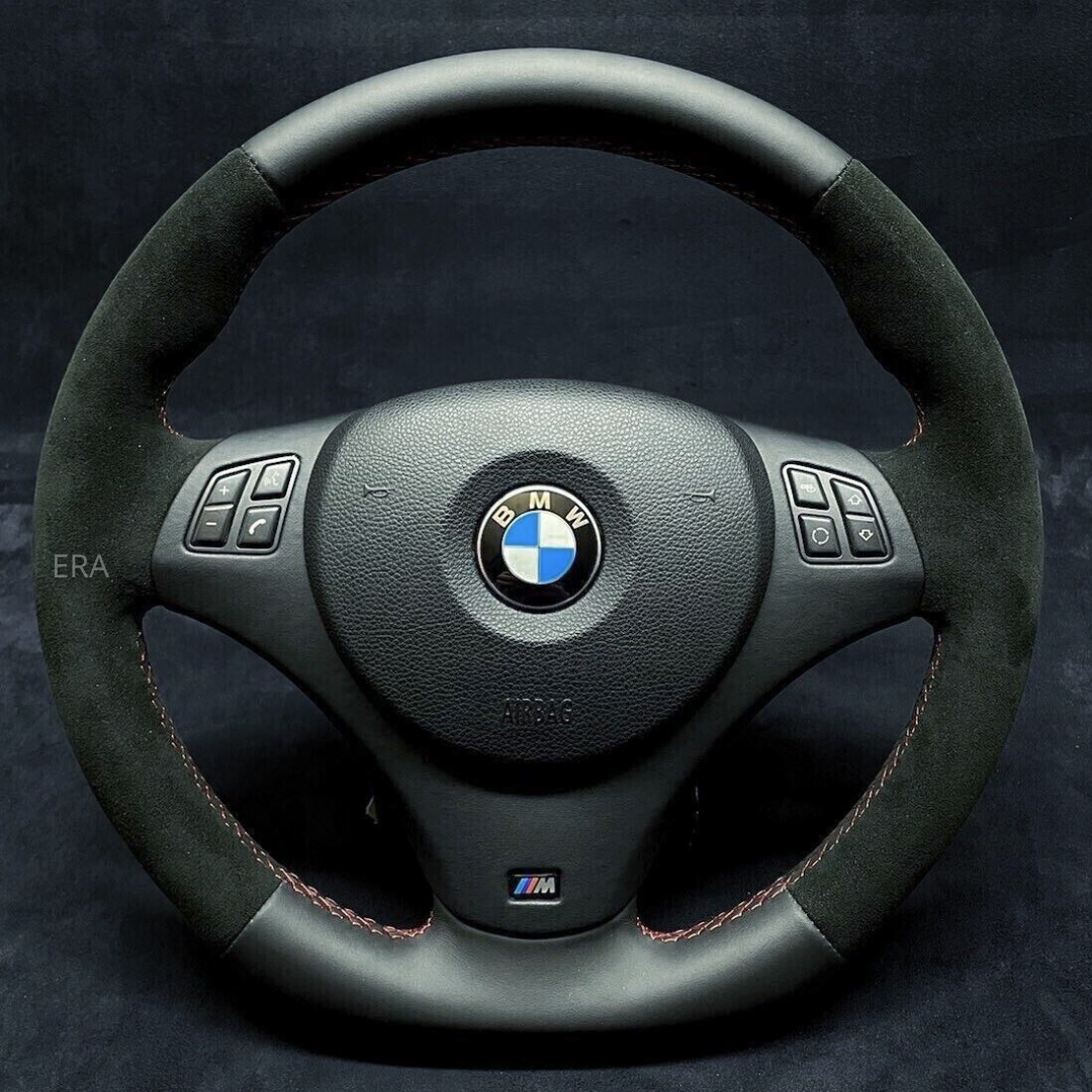 Custom steering wheel for BMW with black Nappa-Alcantara leather trim, red stitching and flat bottom design