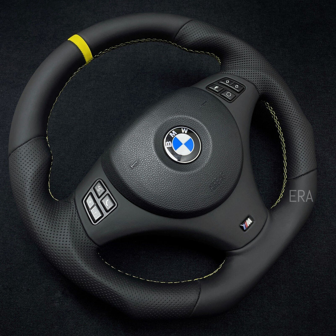 Custom steering wheel for BMW with yellow stitching and stripe 