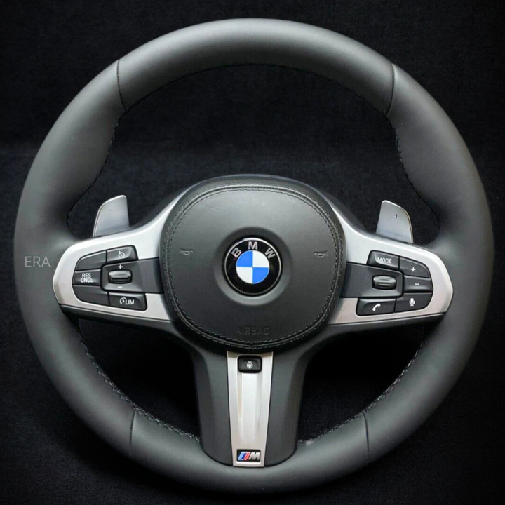 BMW steering wheel with logo and controls on a black background nappa leather