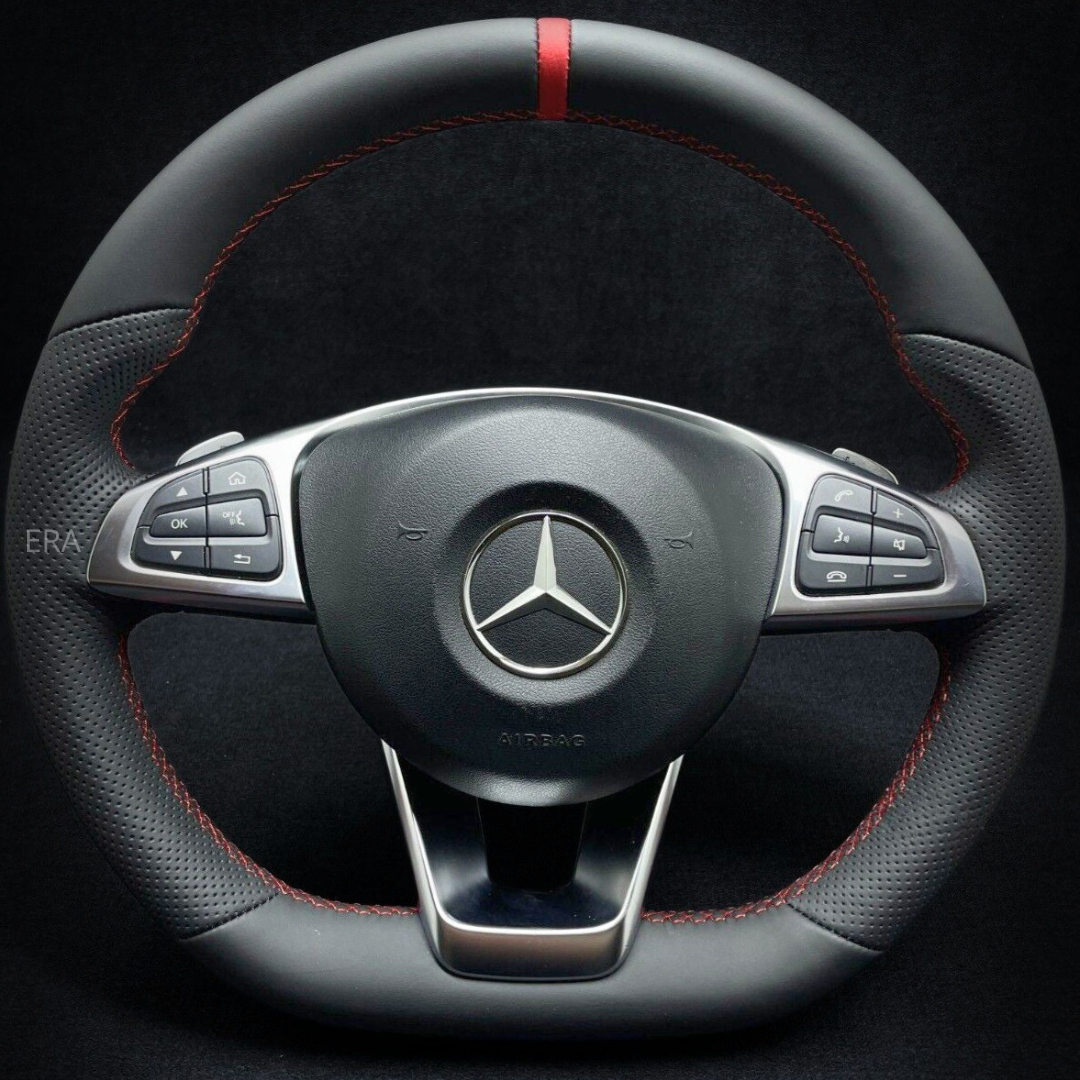 Mercedes-Benz steering wheel with red stitching on a black background