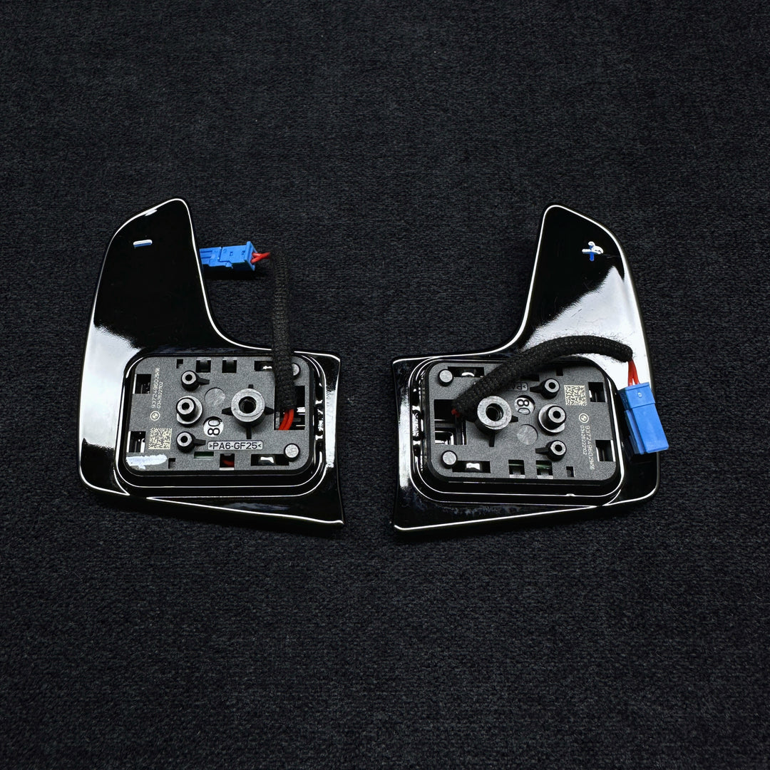 black piano shift paddles designed for a BMW G SERIES